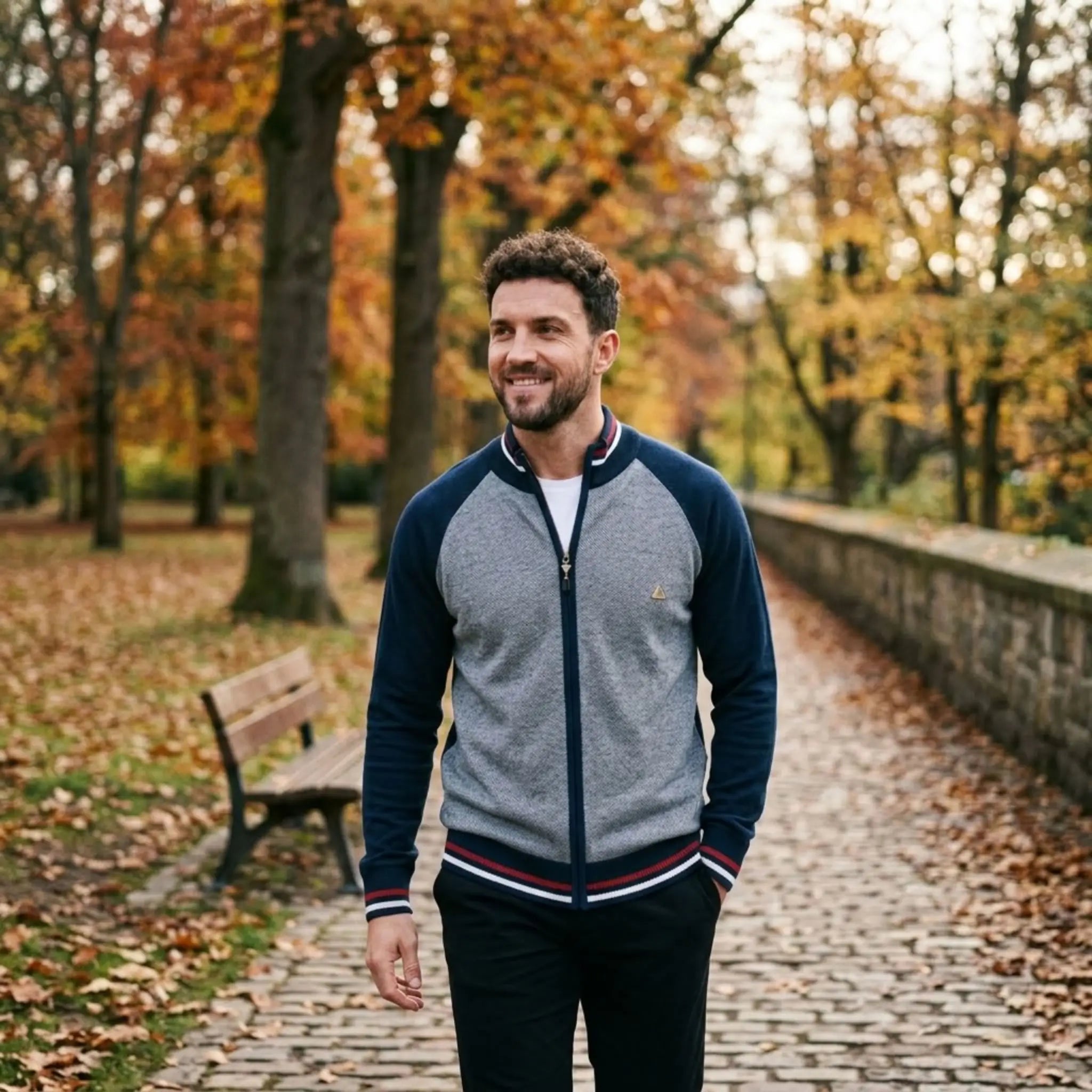 MannerCo navy raglan sleeve cardigan sweater worn outdoors in autumn park setting