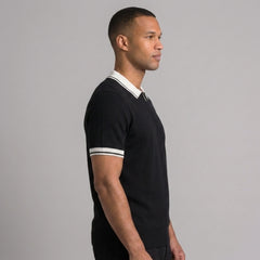 Back view of man wearing royal blue color block knit polo shirt with lapel collar