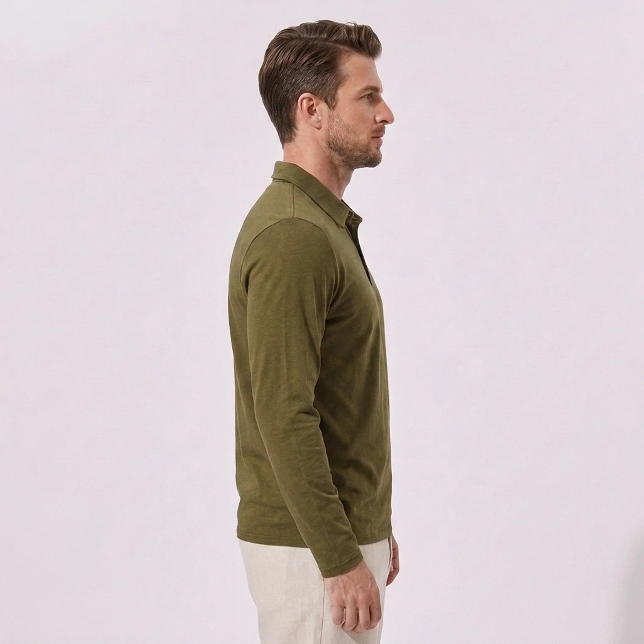 Back view of man wearing sky blue solid long sleeve cotton polo shirt