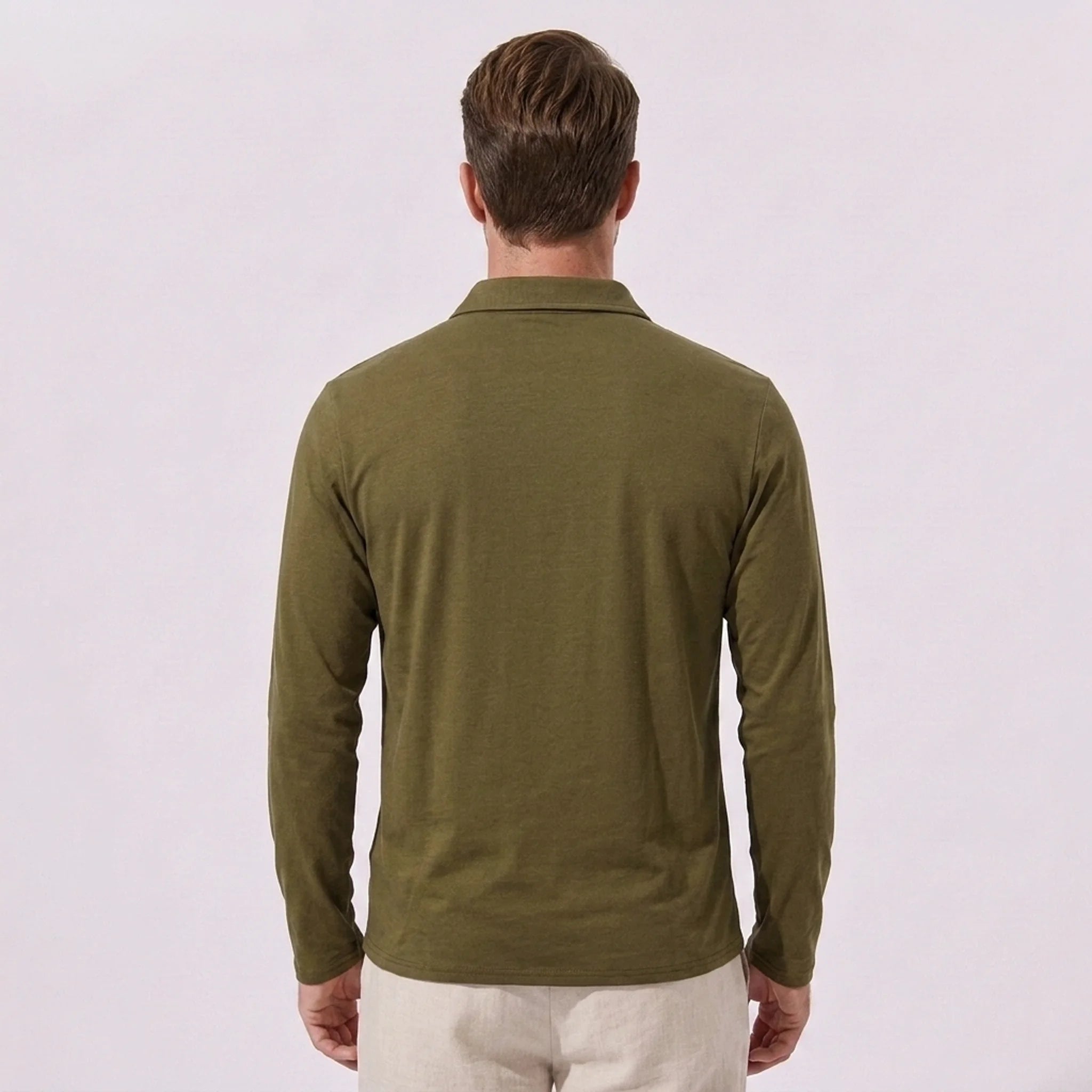 Side view of man in sky blue solid long sleeve cotton polo shirt