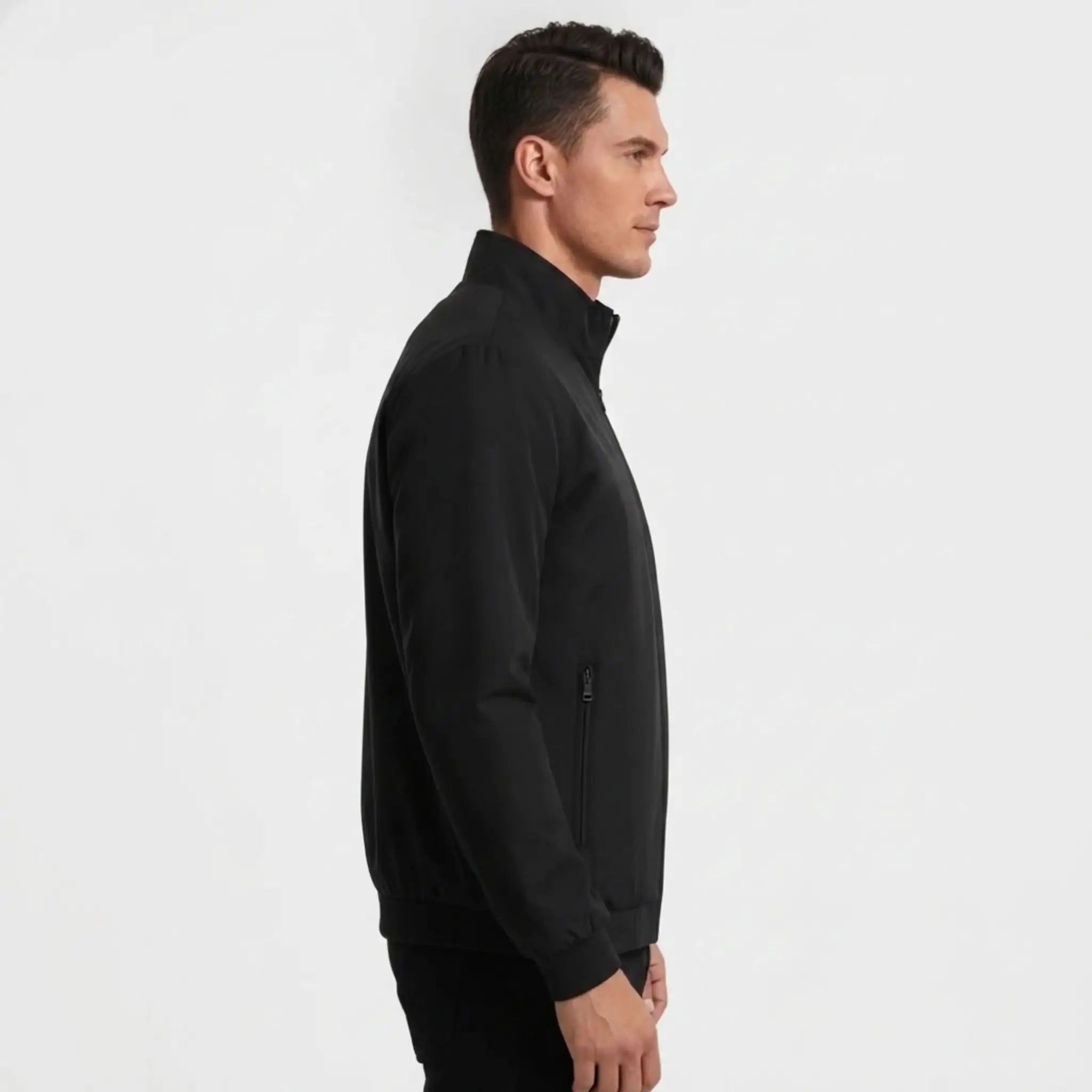 Man wearing MannerCo black stand collar zip-up cardigan jacket in outdoor lifestyle setting