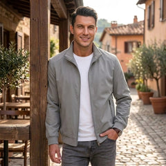 Man wearing MannerCo gray stand collar zip-up cardigan jacket in outdoor lifestyle setting