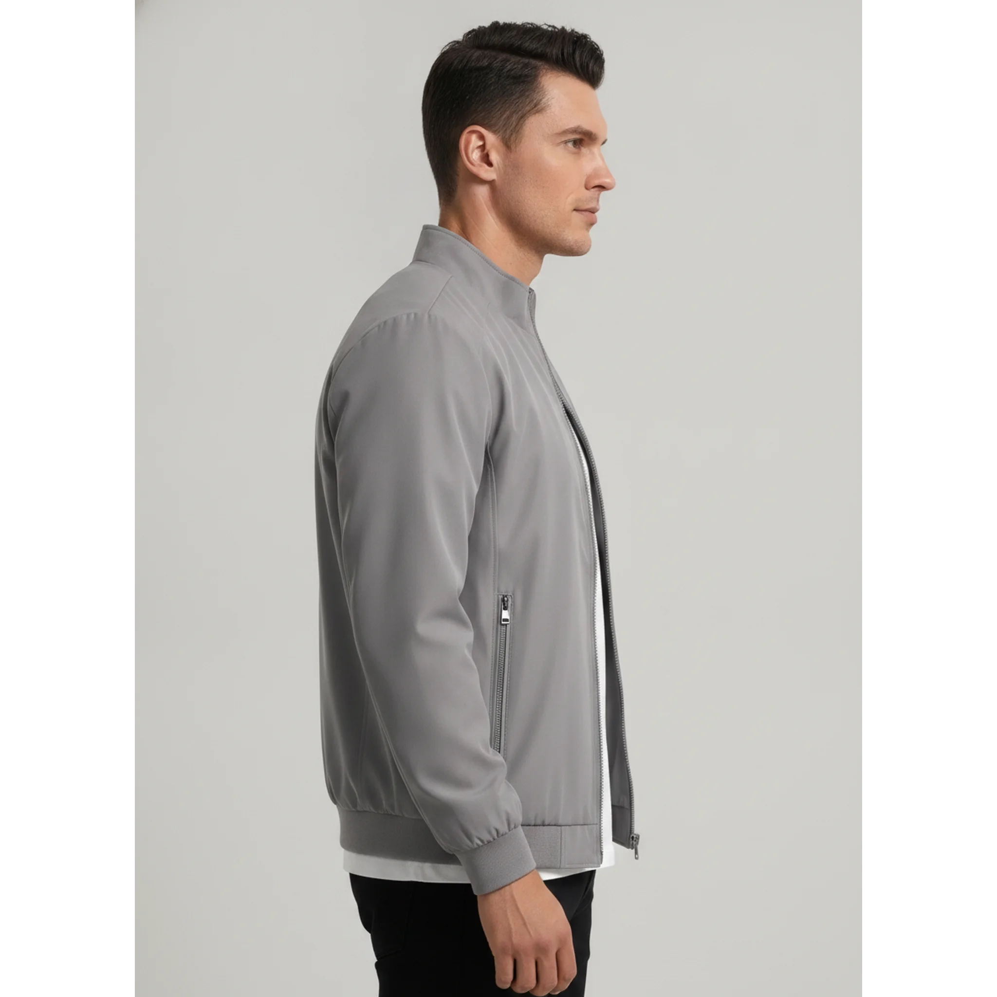Man wearing MannerCo gray stand collar zip-up cardigan jacket, side view on plain background