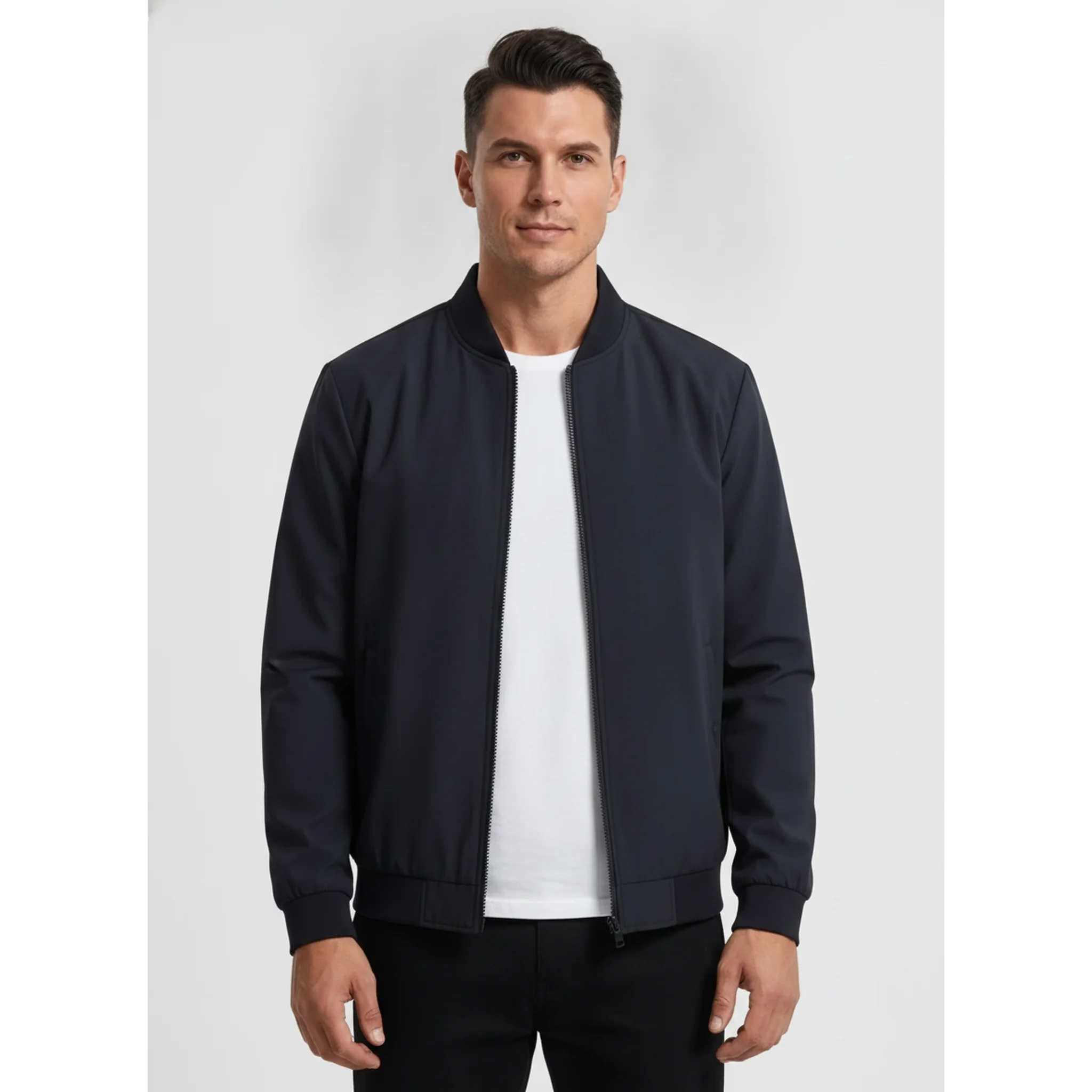 Man wearing MannerCo navy blue stand collar zip-up cardigan jacket, front view on plain background