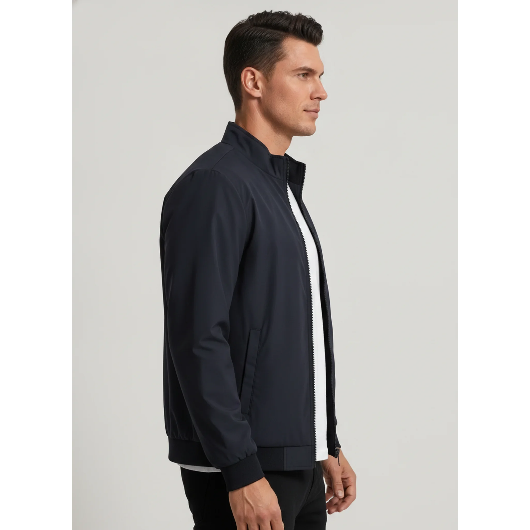 Man wearing MannerCo navy blue stand collar zip-up cardigan jacket, side view on plain background