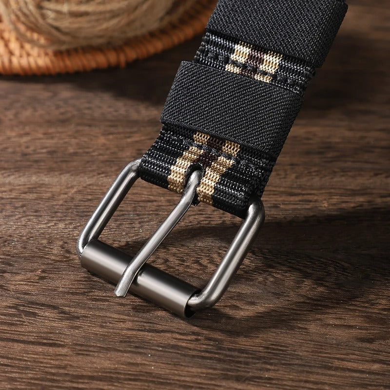 Man wearing striped canvas braided belt on jeans in casual outdoor lifestyle setting