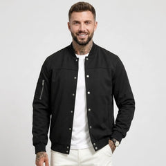 Man wearing MannerCo black suede-blend stand collar jacket with button closure, front view
