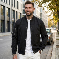 Man wearing MannerCo black suede-blend stand collar jacket in outdoor lifestyle setting