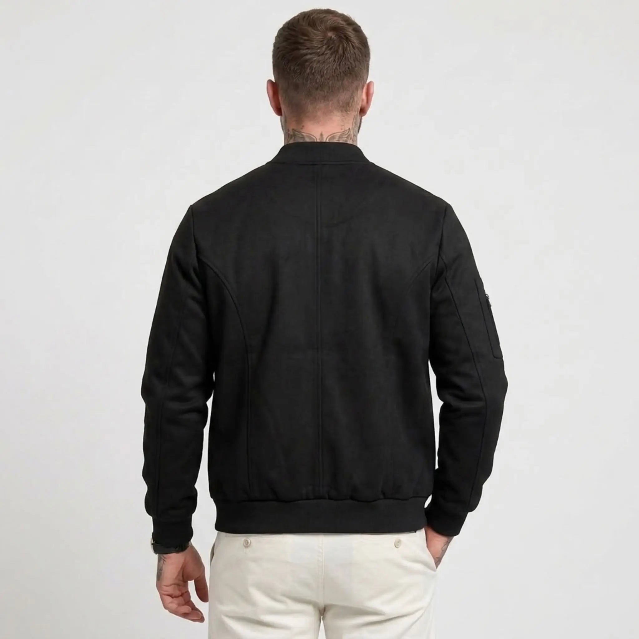 Man wearing MannerCo black suede-blend stand collar jacket in outdoor lifestyle setting
