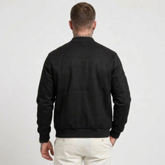 Man wearing MannerCo black suede-blend stand collar jacket in outdoor lifestyle setting