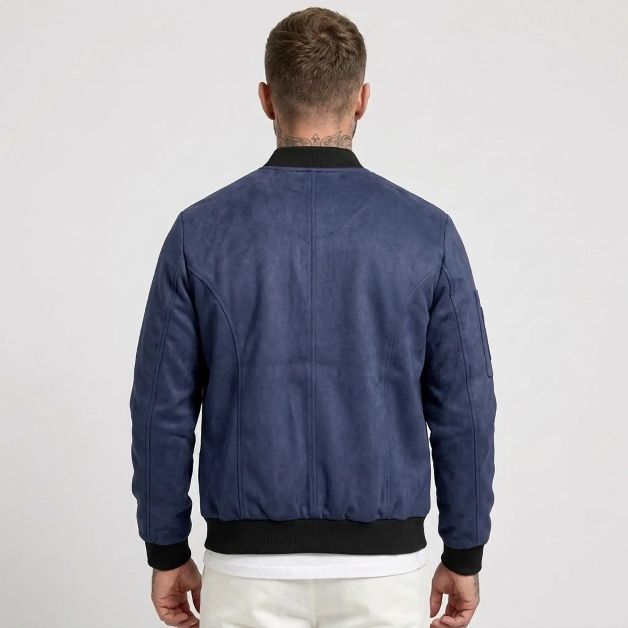 Man wearing MannerCo navy blue suede-blend stand collar jacket, back view on plain background