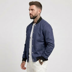 Man wearing MannerCo navy blue suede-blend stand collar jacket, side view on plain background
