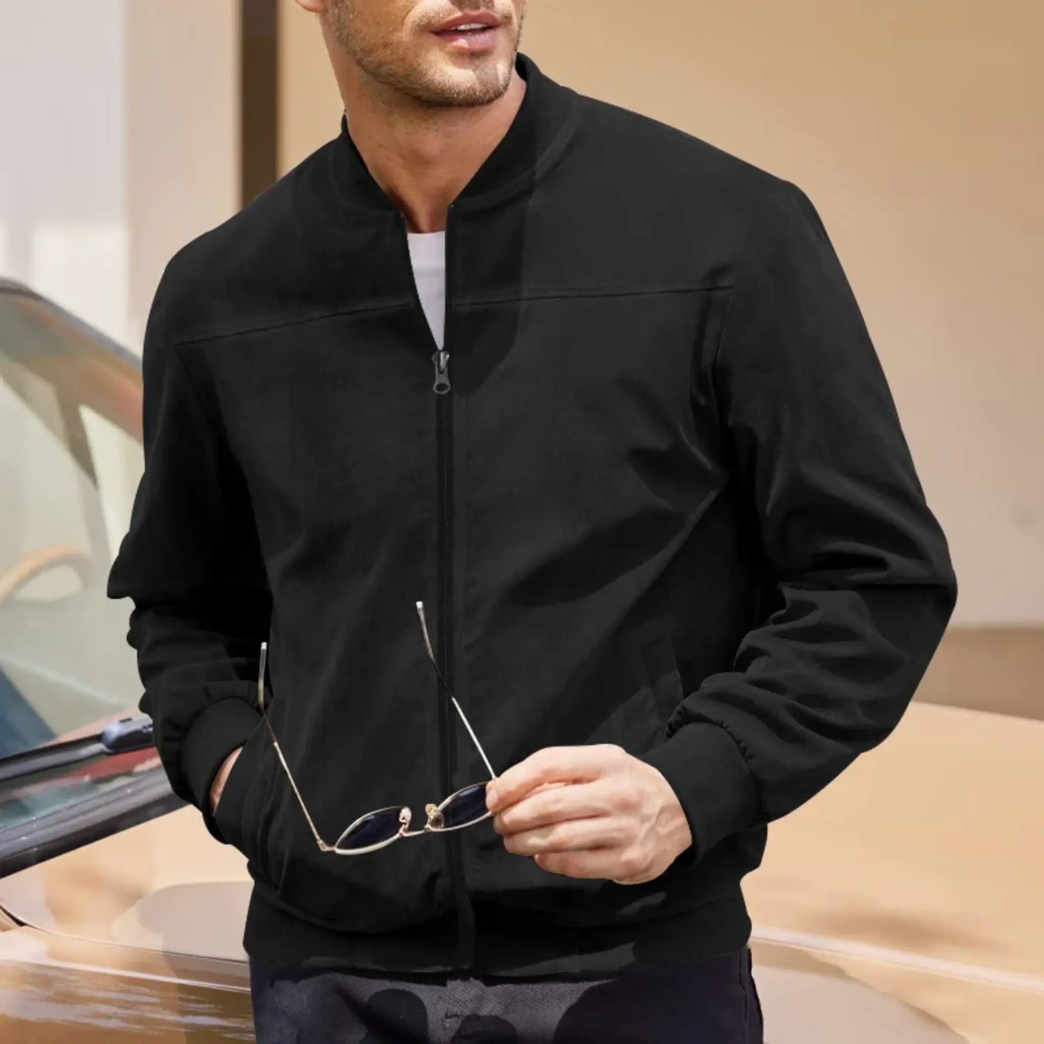 MannerCo black suede thermal jacket with stand collar and zip closure worn by male model outdoors