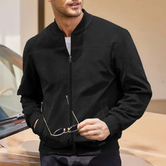 MannerCo black suede thermal jacket with stand collar and zip closure worn by male model outdoors