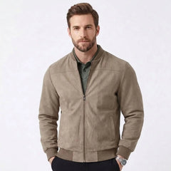 MannerCo khaki suede thermal jacket with stand collar and zip closure styled over green polo shirt
