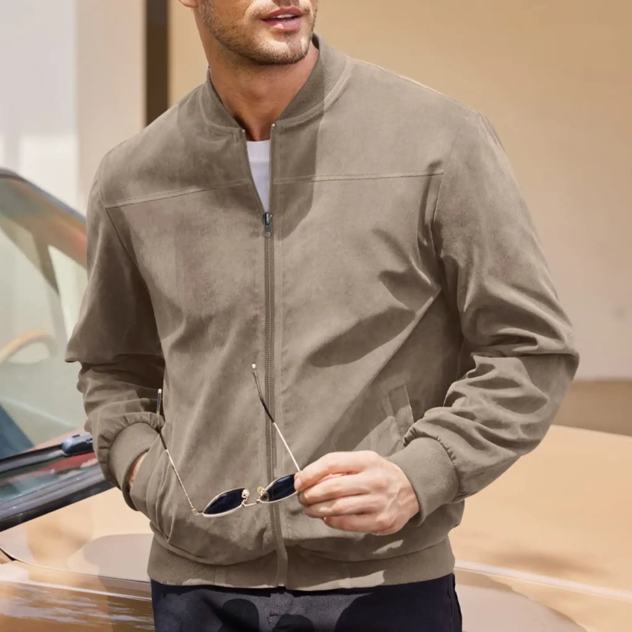 MannerCo khaki suede thermal jacket with stand collar and zip closure styled with sunglasses outdoors