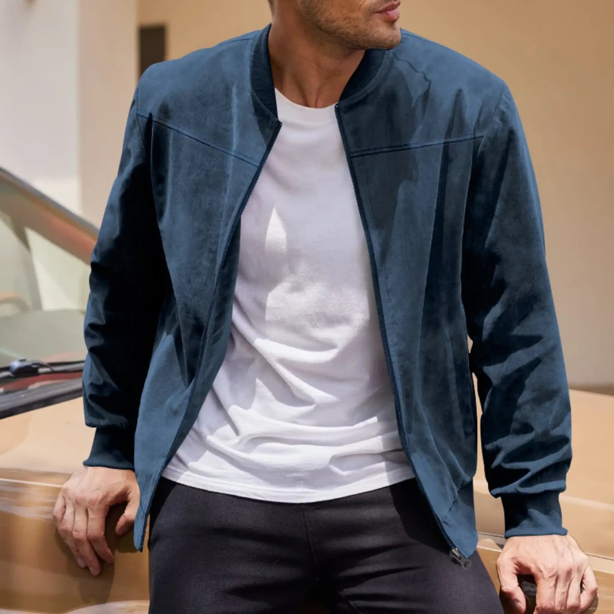 MannerCo navy blue suede thermal jacket worn open over white tee lifestyle indoor shot