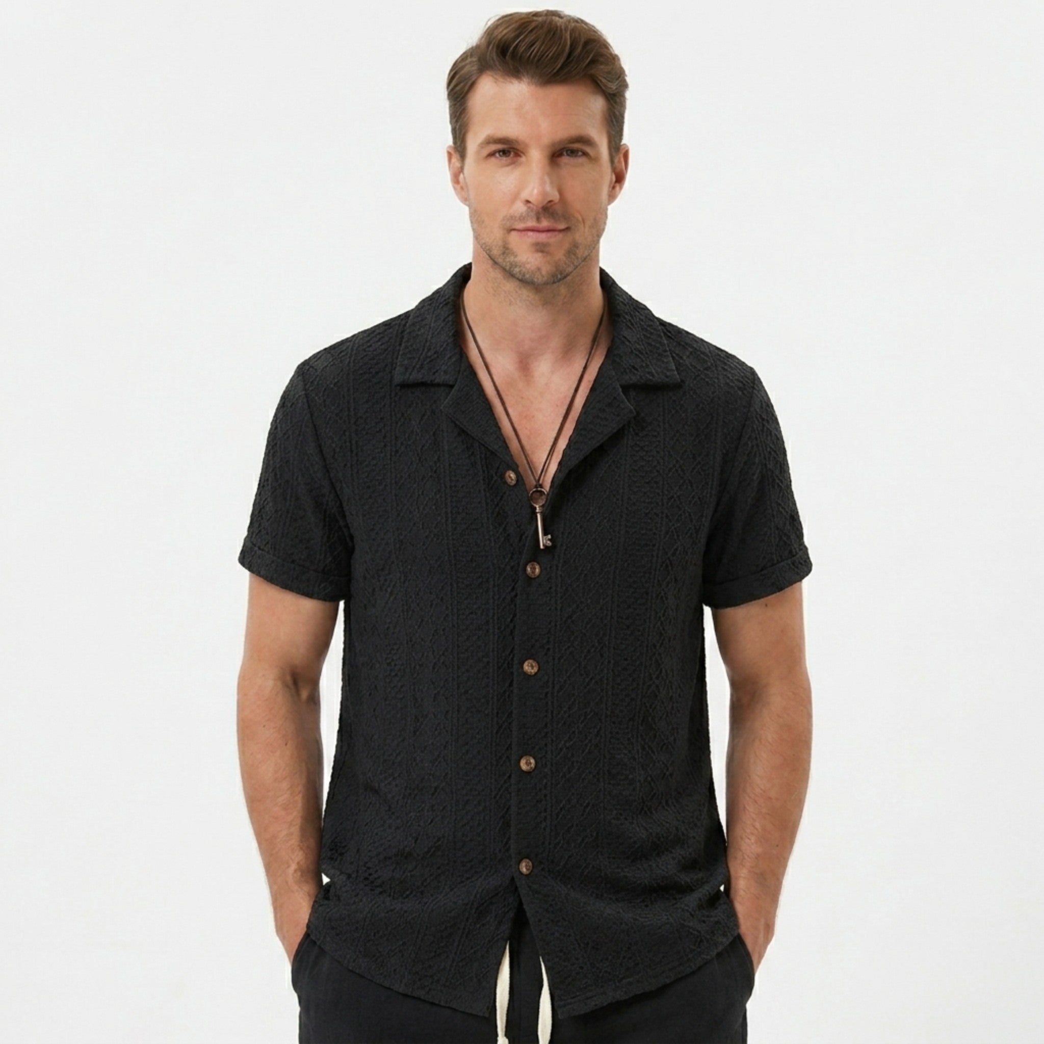 Man wearing tan floral checkerboard jacquard Cuban shirt and linen cotton drawstring shorts front view
