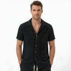 Man wearing tan floral checkerboard jacquard Cuban shirt and linen cotton drawstring shorts front view