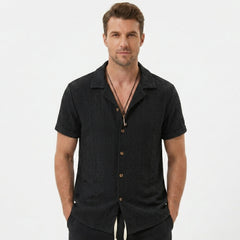 Man wearing tan floral checkerboard jacquard Cuban shirt and linen cotton drawstring shorts front view