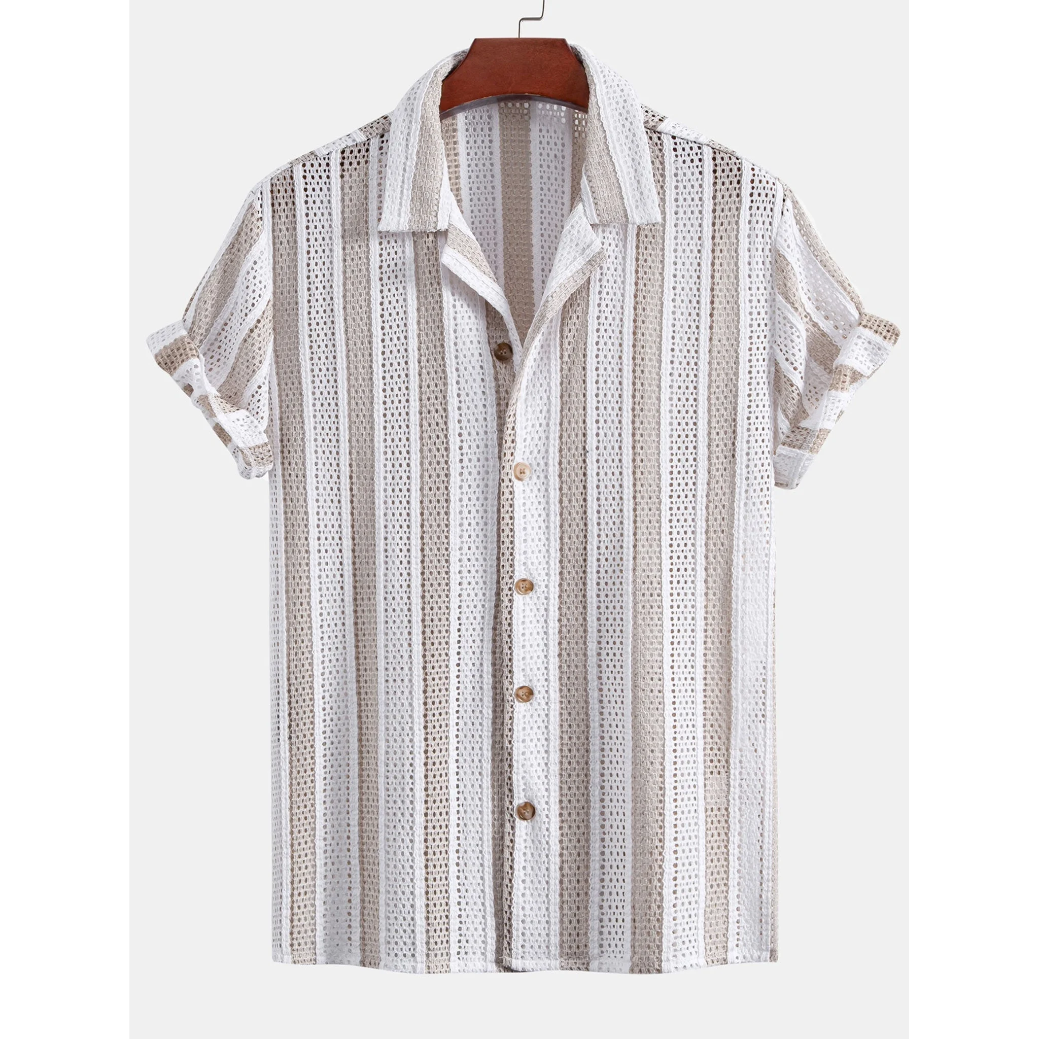 Full length front view of man wearing tan mesh Cuban collar shirt and straight leg beige pants