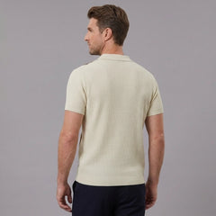 Back view of man wearing tan striped knit slim fit polo shirt