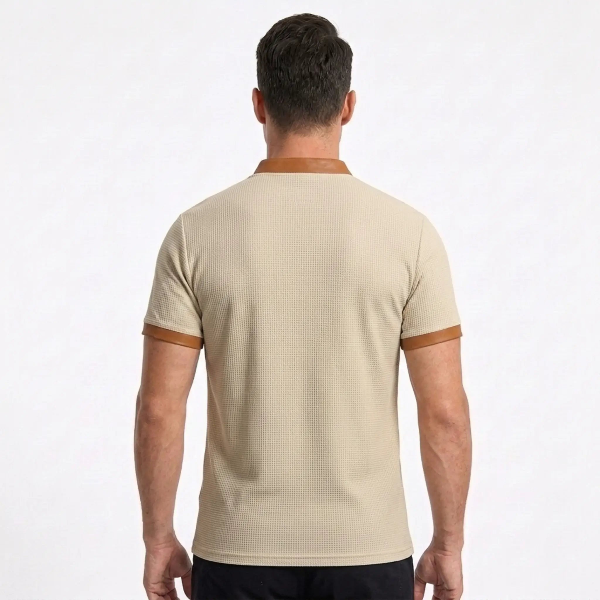 MannerCo waffle knit pullover in apricot with tan collar and cuff trim, back view on male model