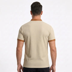 MannerCo waffle knit pullover in apricot with tan collar and cuff trim, back view on male model