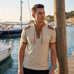 MannerCo apricot waffle knit pullover with tan lace-up collar and color-block shoulders, worn at marina