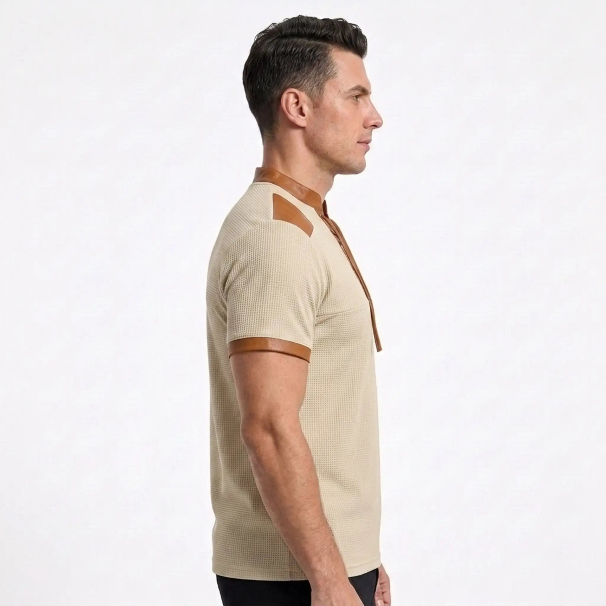 MannerCo waffle knit pullover in apricot with tan leather-trim stand collar and sleeve detail, side view