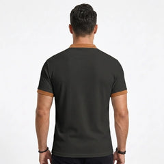 MannerCo black waffle knit polo back view with tan contrast collar and sleeve cuffs