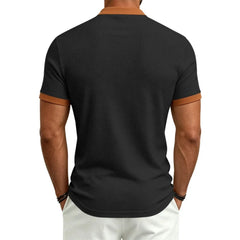 MannerCo black waffle knit color-block polo back view with camel collar and sleeve trim
