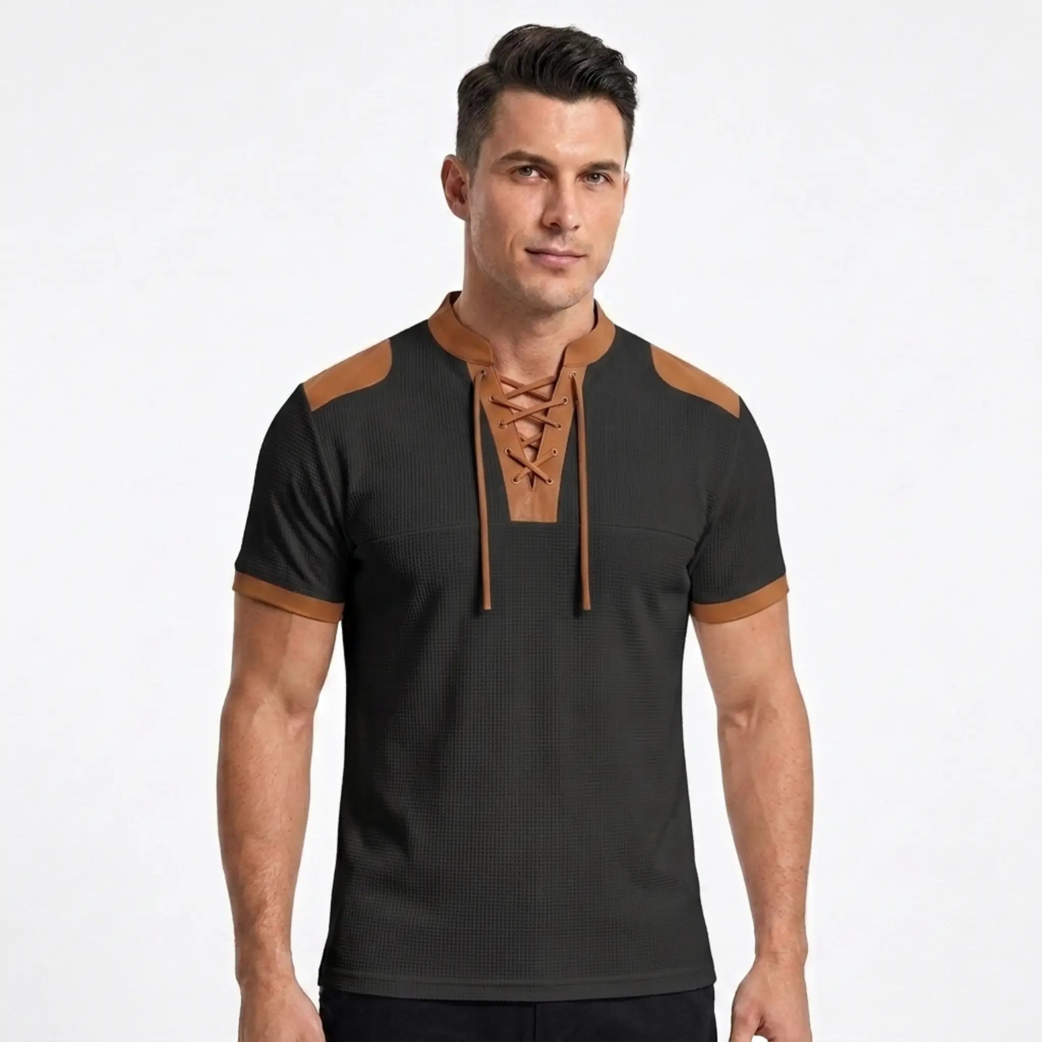 MannerCo black waffle knit color-block pullover with tan lace-up stand collar and shoulder patches, front view