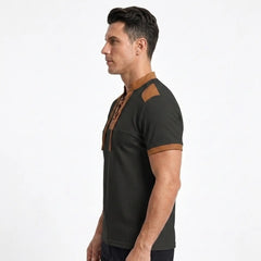 MannerCo black waffle knit pullover with tan stand collar, shoulder patch, and sleeve trim, side view