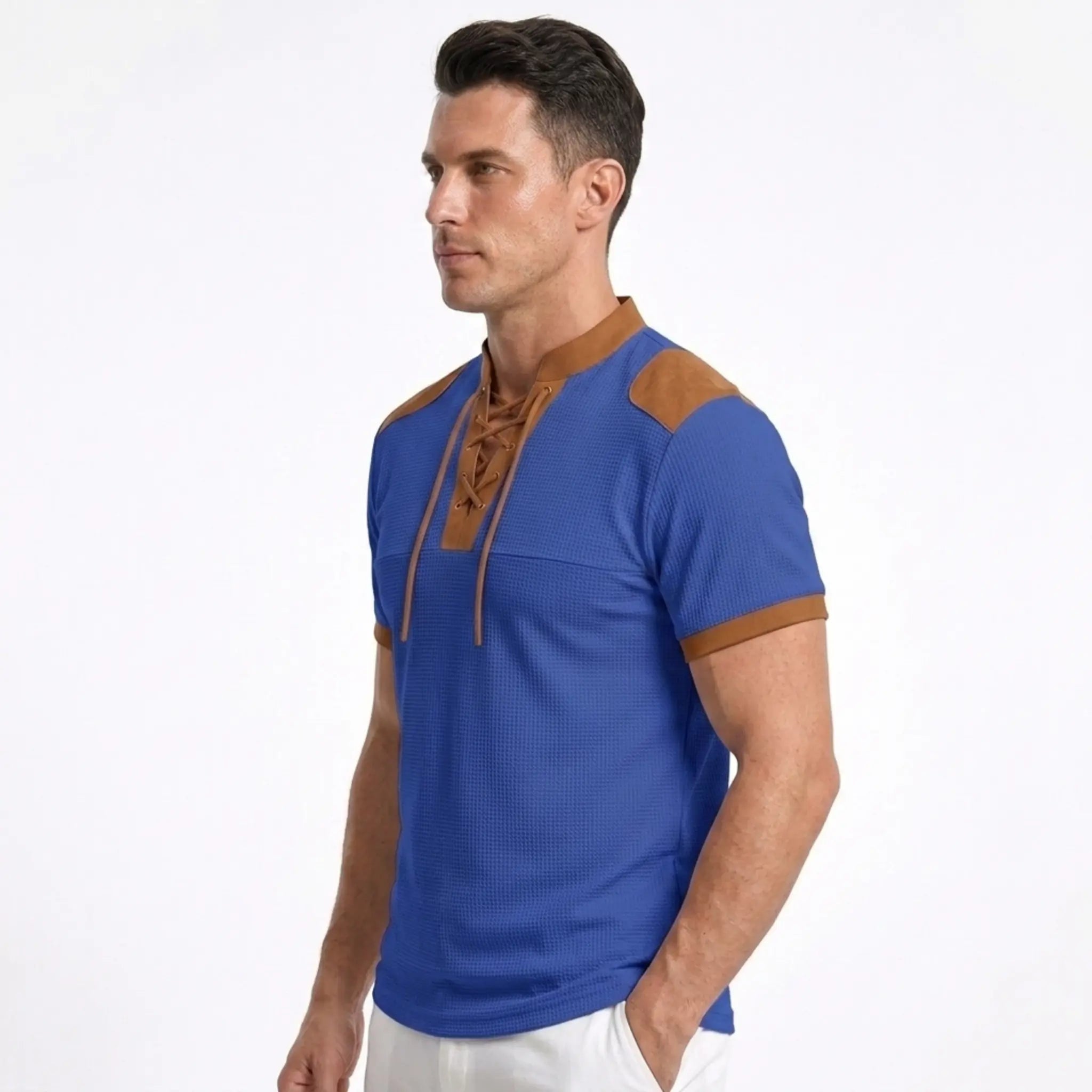 MannerCo blue waffle knit color-block pullover with tan stand collar, lace-up neckline, and shoulder patch detail, side view