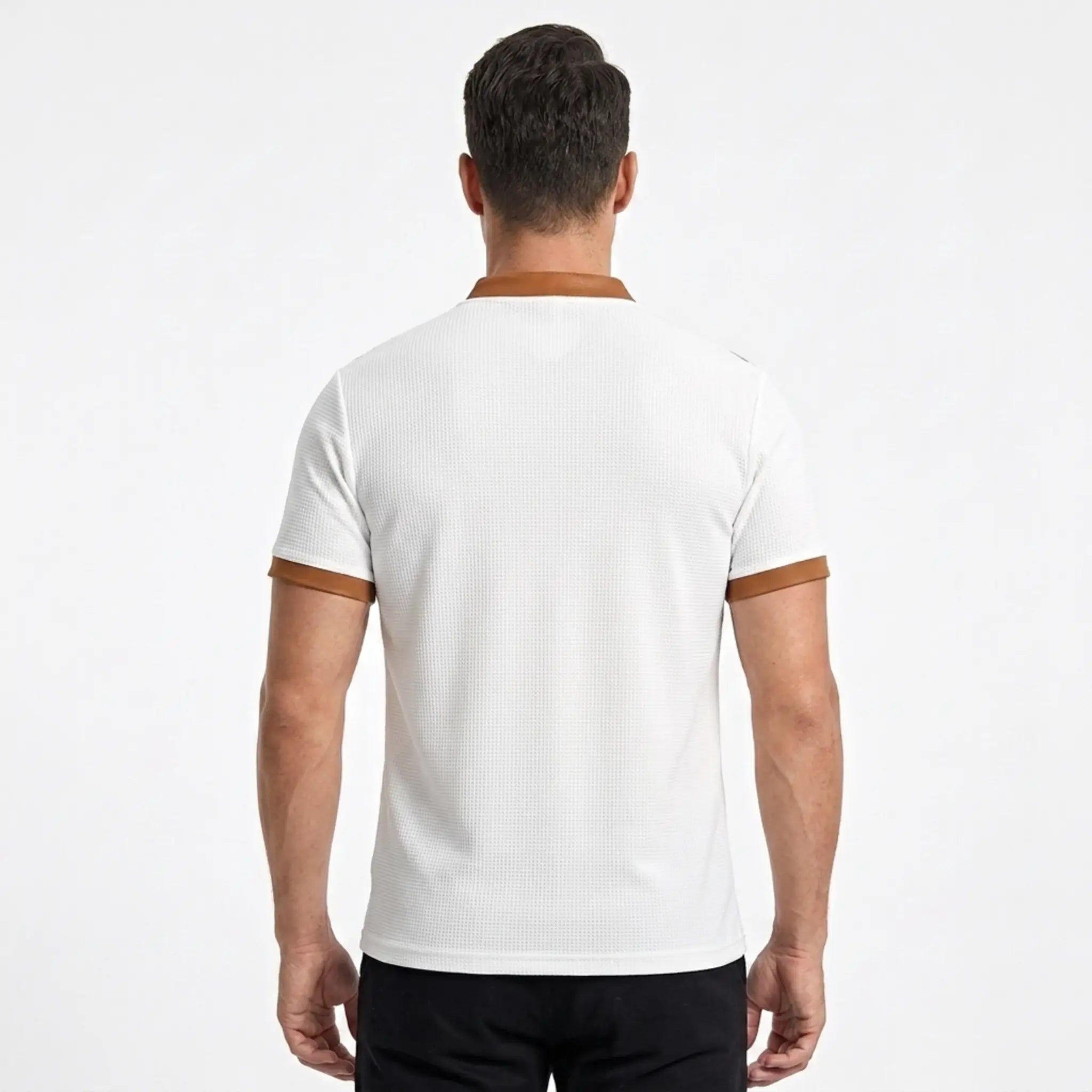 MannerCo white waffle knit polo back view with tan color-block collar and sleeve cuffs
