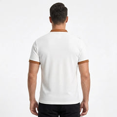 MannerCo white waffle knit polo back view with tan color-block collar and sleeve cuffs