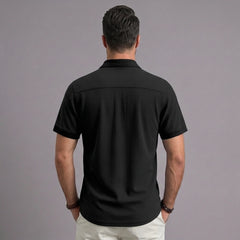 Back view of MannerCo black waffle knit short sleeve casual shirt with lapel collar
