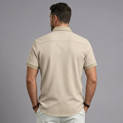 Back view of MannerCo khaki waffle knit short sleeve shirt with lapel collar and contrast cuffs