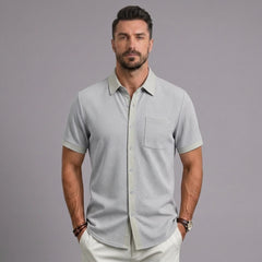 Man wearing MannerCo light gray waffle knit short sleeve casual shirt with lapel collar and chest pocket