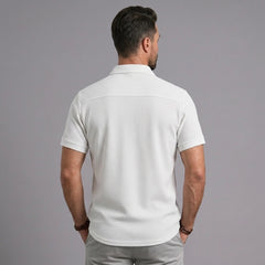 Back view of man wearing white waffle knit short sleeve casual shirt with lapel collar