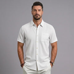 Man wearing MannerCo white waffle knit short sleeve shirt with lapel collar and chest pocket