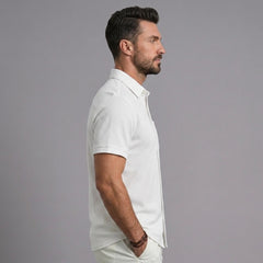 Man wearing white waffle knit short sleeve casual shirt with lapel collar, side profile view