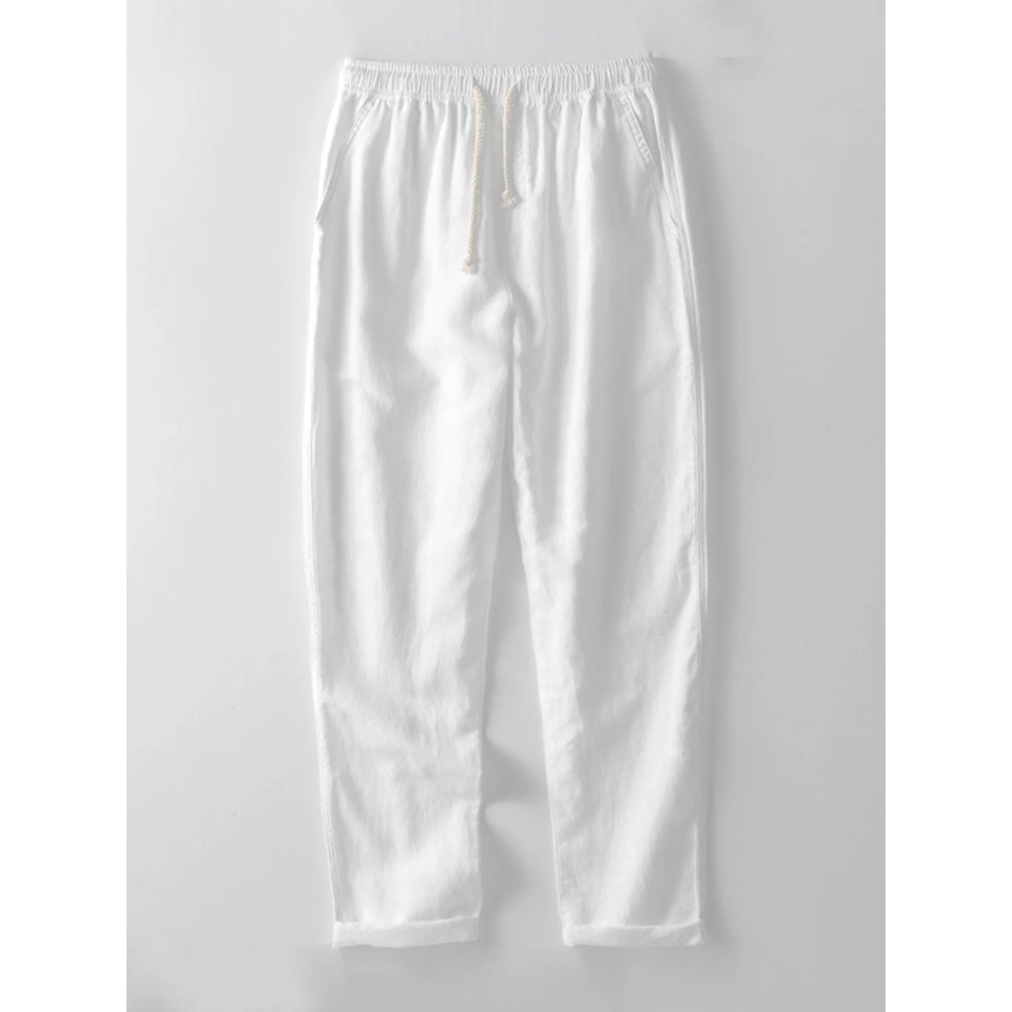 Man wearing white and beige geometry textured Cuban shirt and straight leg linen pants front view