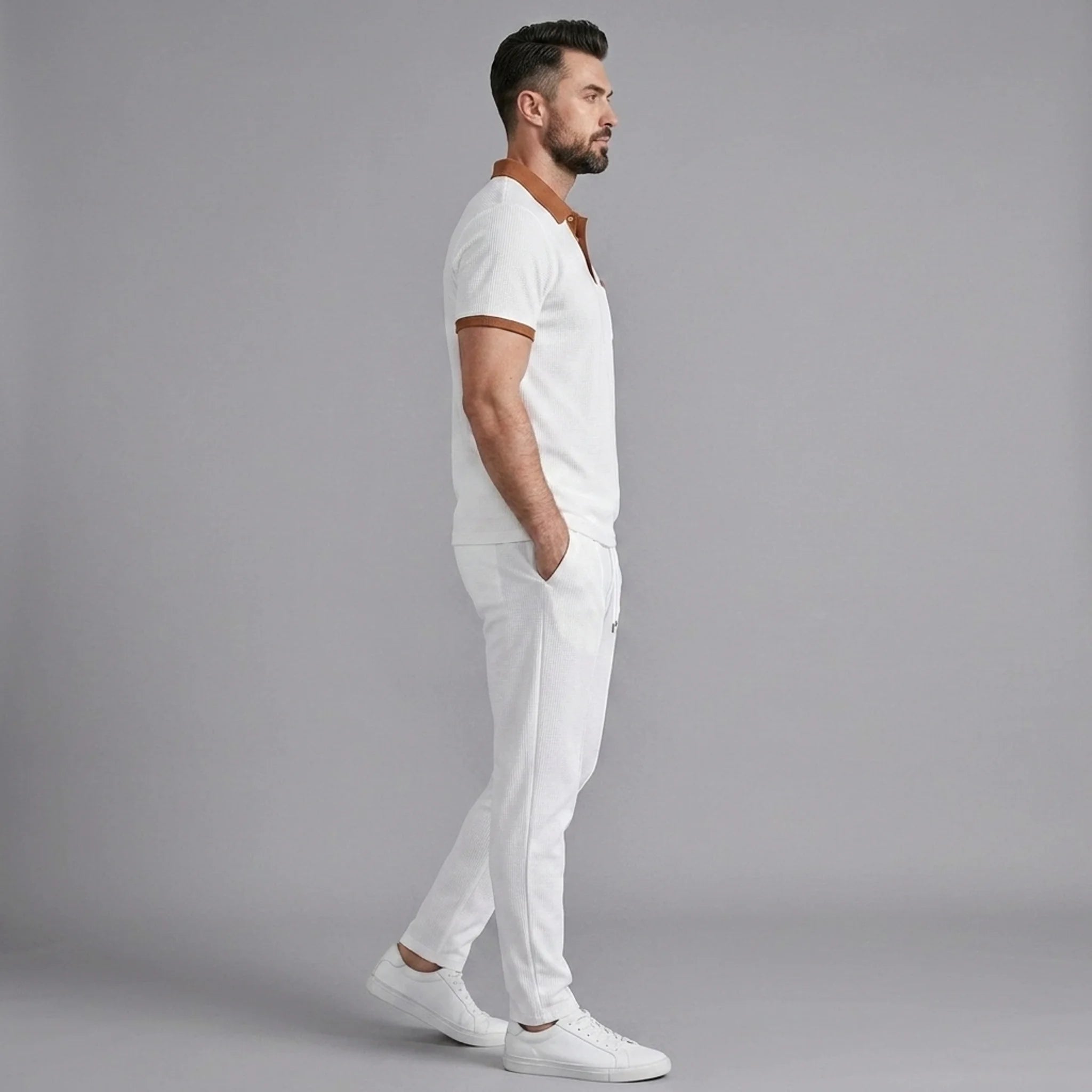 Back view of man wearing white color block waffle polo and straight leg pants