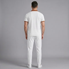 Side view of man in white color block waffle polo and straight leg pants