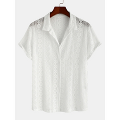 Full length view of man wearing white geometry textured Cuban shirt and linen pants on white background