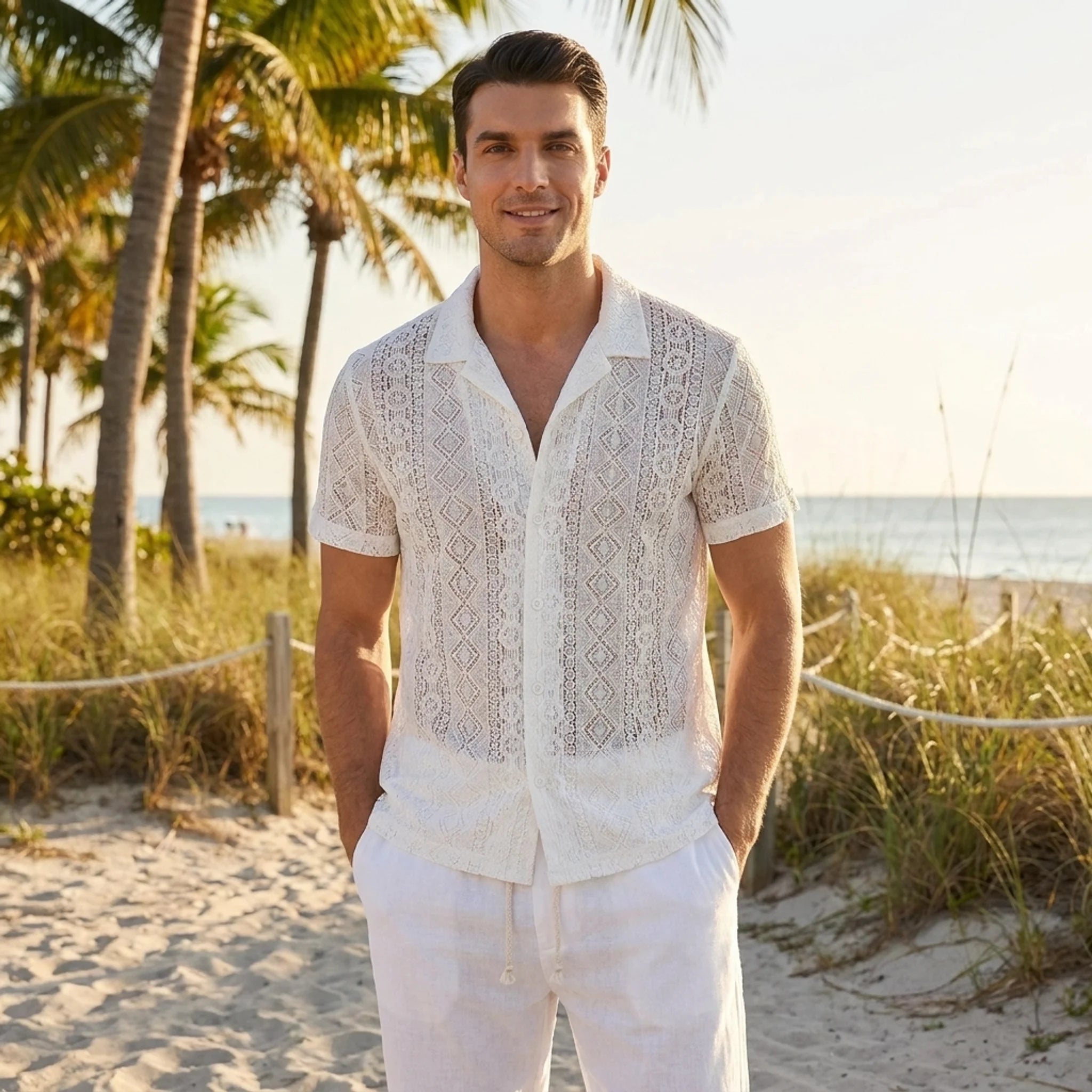 Man wearing white geometry textured Cuban shirt and linen pants in outdoor lifestyle setting