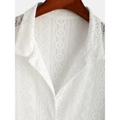 Man in white geometry textured Cuban shirt and linen pants walking in sunny outdoor summer scene