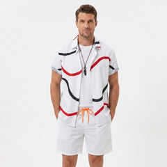 Back view of man wearing white line print button up shirt and swim shorts